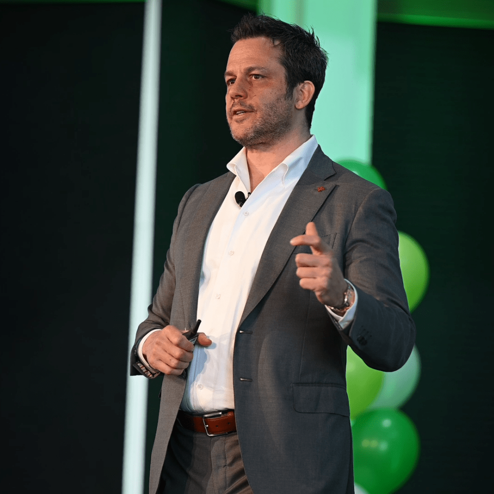 Ryan Estis speaking on stage