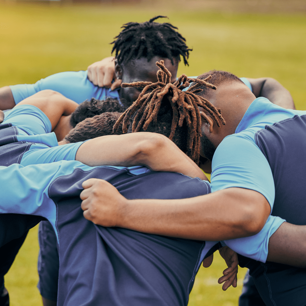 sports team huddled together