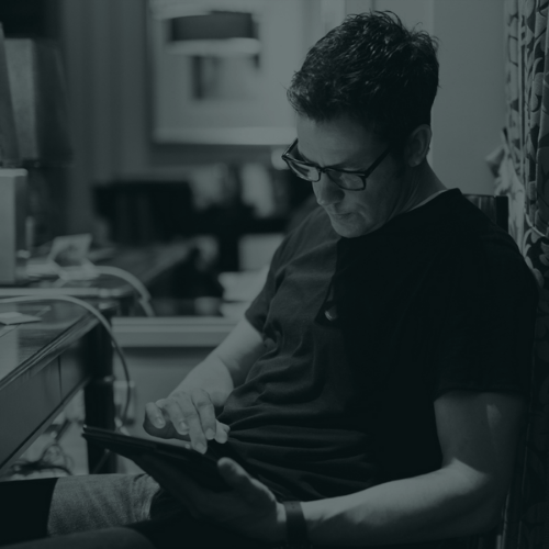 A photo of Ryan Estis reading a book.