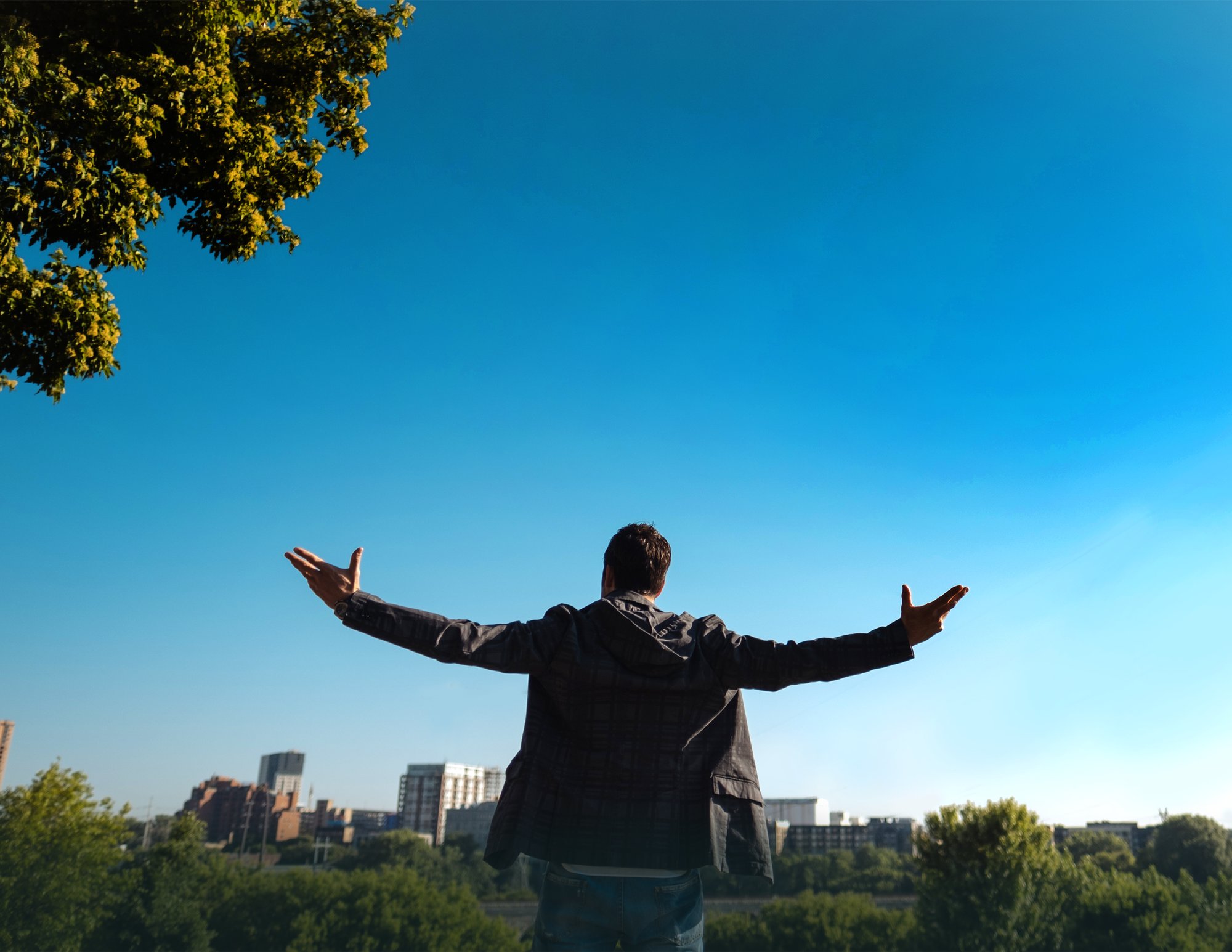 Human centered growth - a man with arms outstretched