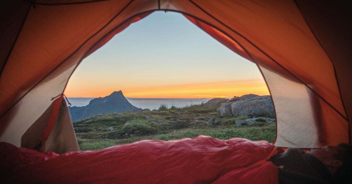 Tent view of a landscape at sunrise